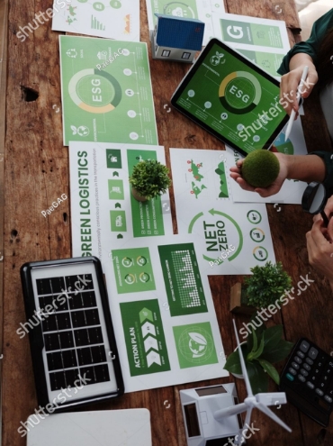 stock-photo-managers-using-tablet-and-printouts-showing-esg-net-zero-and-green-logistics-concepts-during-a-2677504375