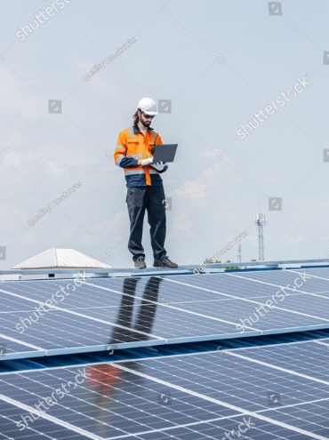 stock-photo-worker-installing-solar-panels-on-the-roof-top-using-laptop-software-online-monitor-checking-status-2628704179